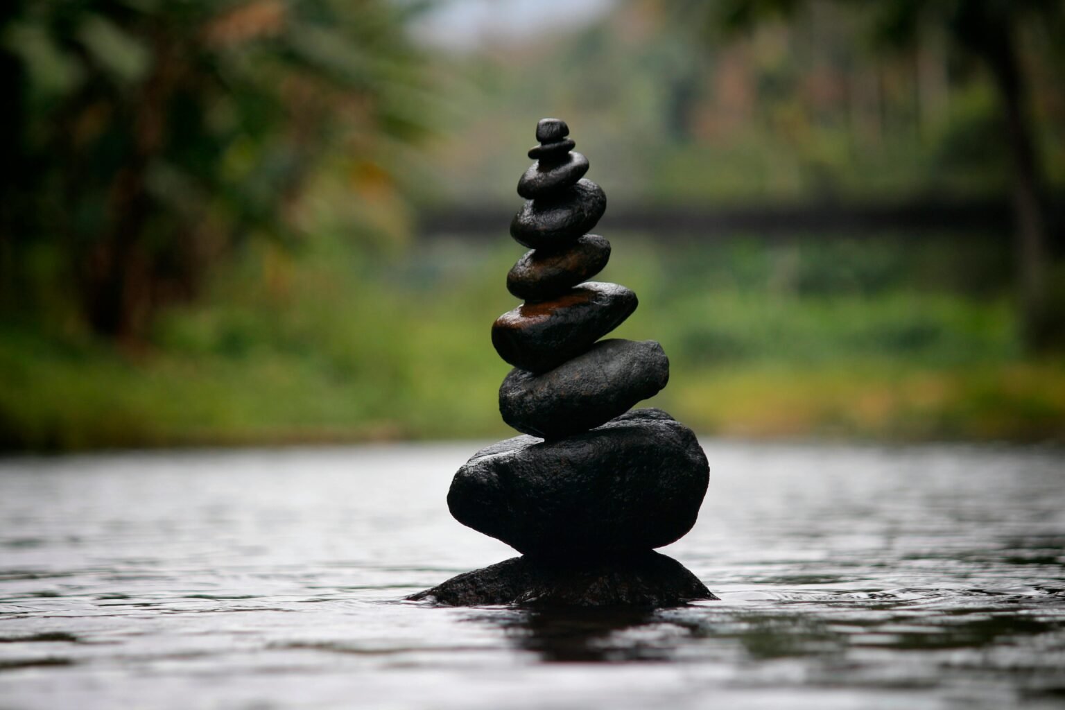 rocks stacked in river